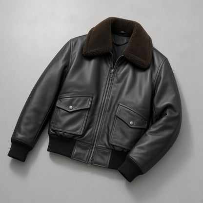 Men's Black G1 Leather Flight Bomber Jacket, flat lay on grey concrete